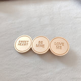 Gold alloy letter clip hair accessory with engraved messages 'SWEET HEART', 'BE MINE', and 'LOVE ME', ideal for weddings or travel gifts in Europe.