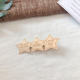 Gold alloy letter clip hair accessories with engraved messages like 'BE MINE' and 'LOVE ME', ideal for weddings and travel gifts in Europe.